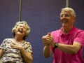 Gail Lawley, left, laughs with Hank Mosser, right, during Laughter Yoga in Tucson, Ariz. on Tuesday, Feb. 3, 2015. Mosser is trapping an imaginary ball in his hands during a laughter excercise. Photographed by Noelle Haro-Gomez