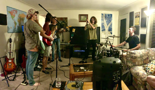 Galactic Cactus practices their released song, Monkey Man, in their home. They plan to release a brand-new song by the end of the year. (Photo by Betty Hurd)