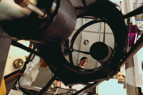 Fuls poses for a photo in the telescope mirror on Oct. 6, 2019 at the Mount Lemmon Sky Center. “I always wanted to be a scientist, I always knew. The thing I like about astronomy is that it’s really accessible. Everyone gets astronomy inherently.”