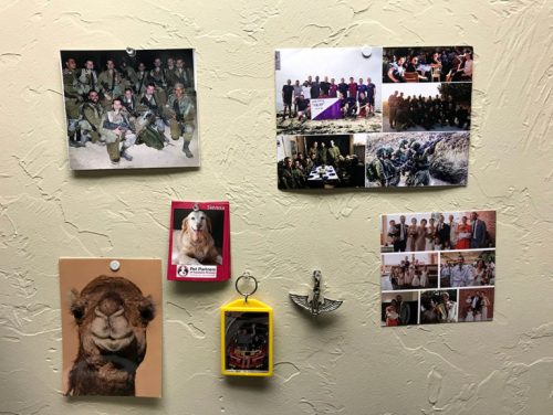 A collage of photos in Yoni Wulf’s dorm room. The photos are from his time serving in the Israeli Defense Force.